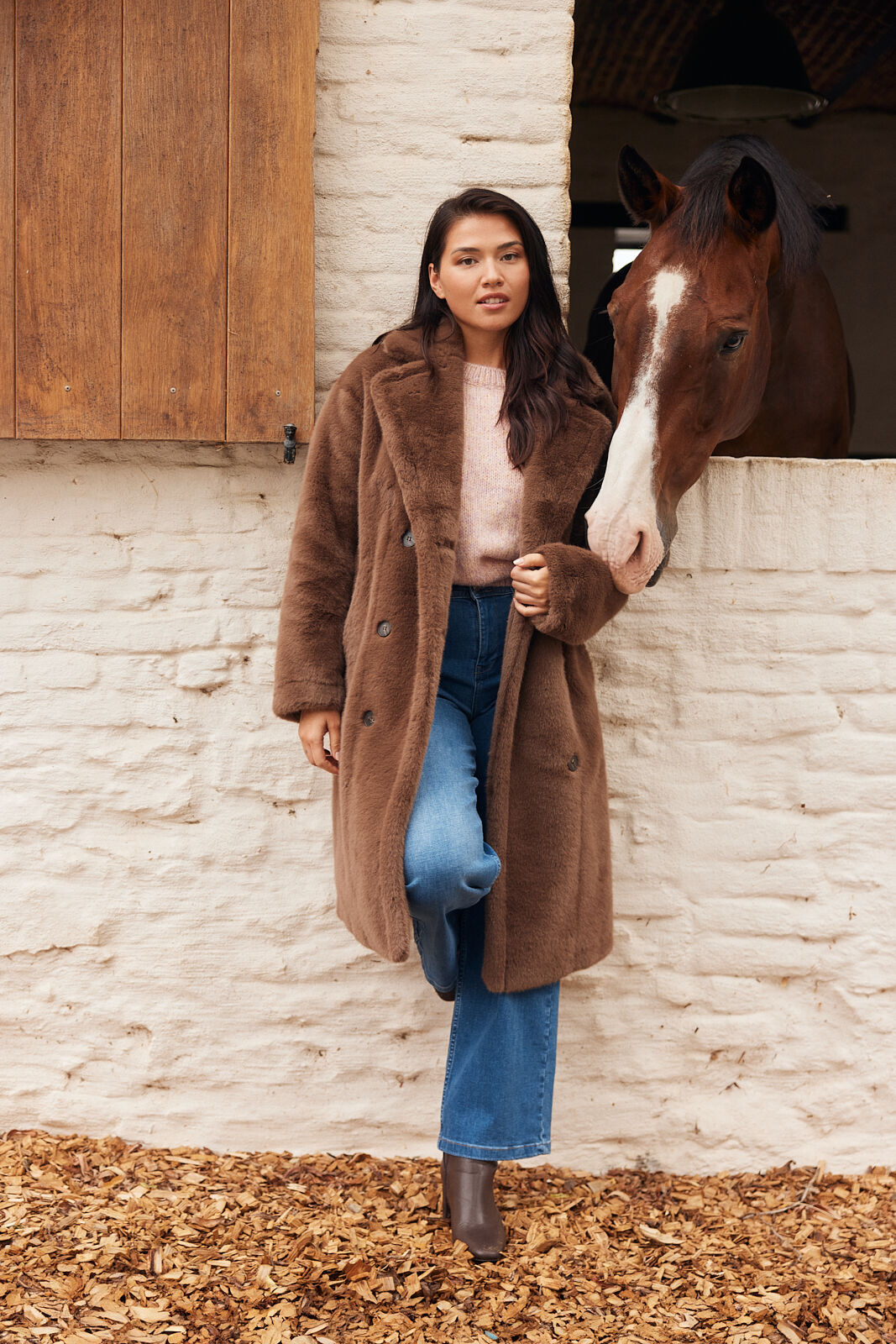 Model wearing a oversized fluffy jacket